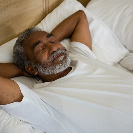 Man sleeping in a bed