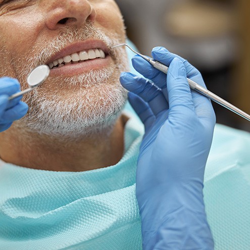 Male patient receiving dental checkup