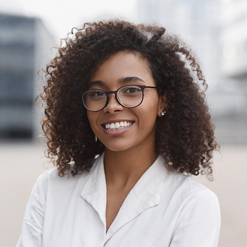 Woman wearing glasses and smiling